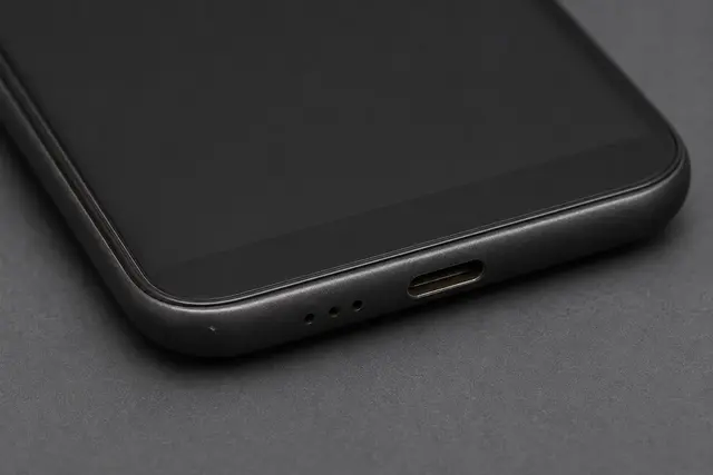 Sample intake photo: close-up of the phone's charge port and speaker grille